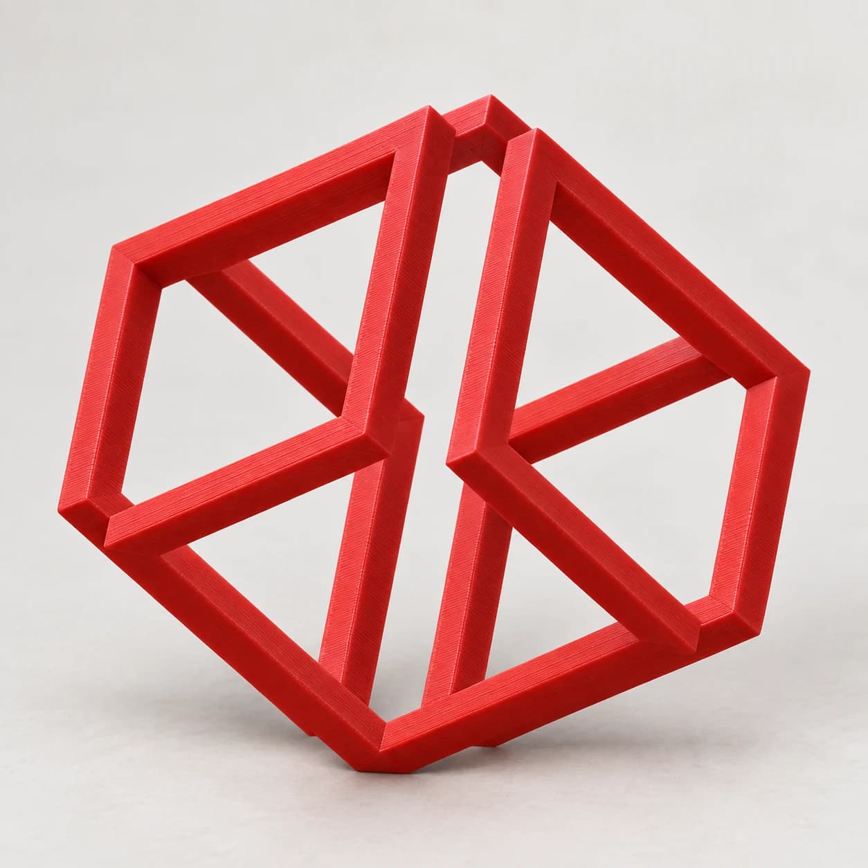 Червен 3D печатен невъзможен куб — оптическа илюзия